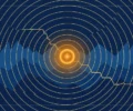 Illustration: seismic wave rings radiating over stylised Himalayan ridges in navy and gold