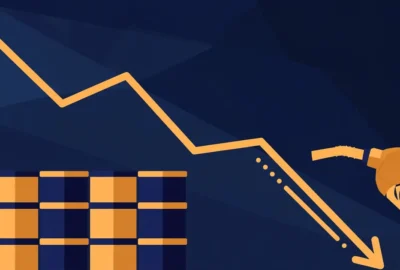 Editorial illustration of stacked oil barrels and a fuel pump nozzle with a downward price-trend arrow